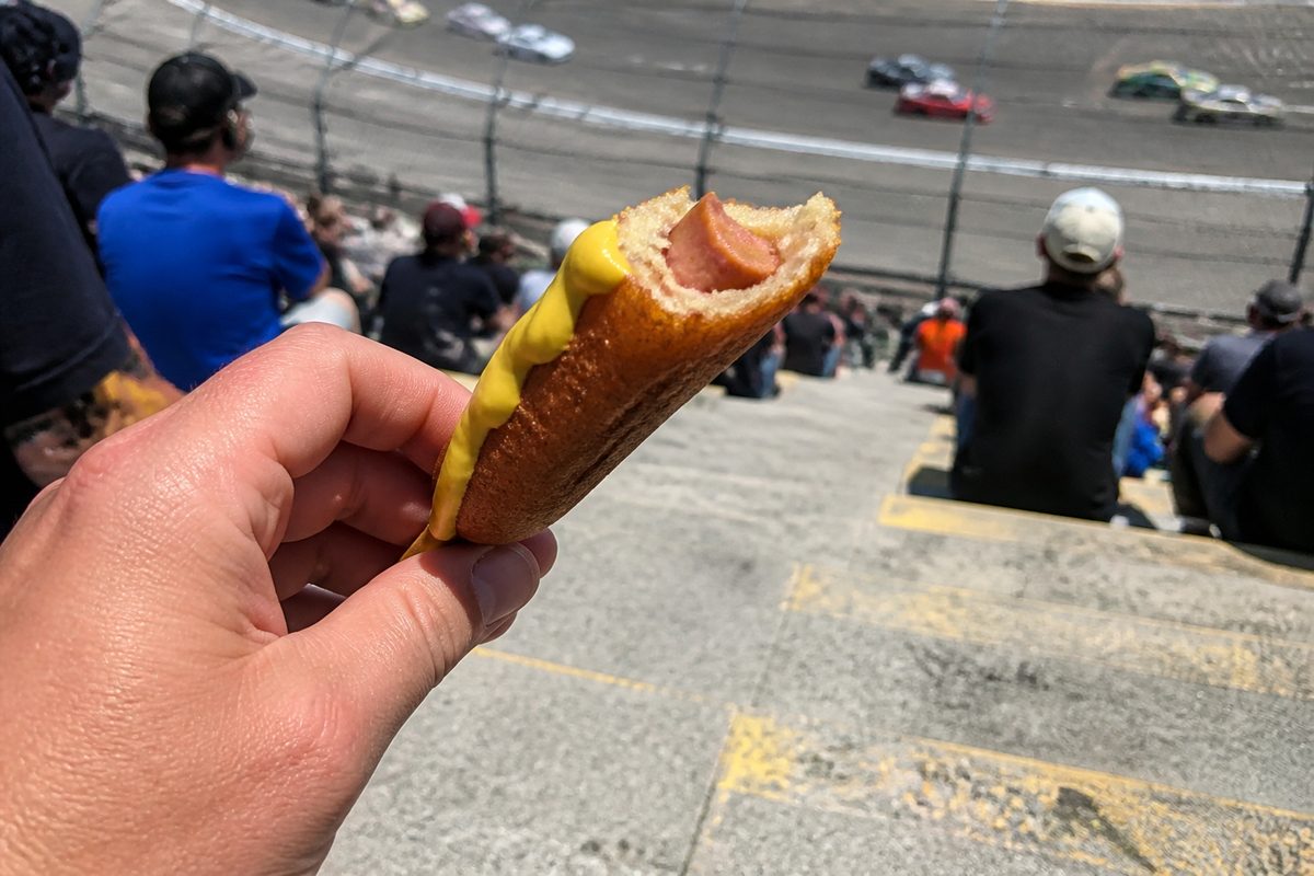 POV of a partially eaten corn dog in the stands