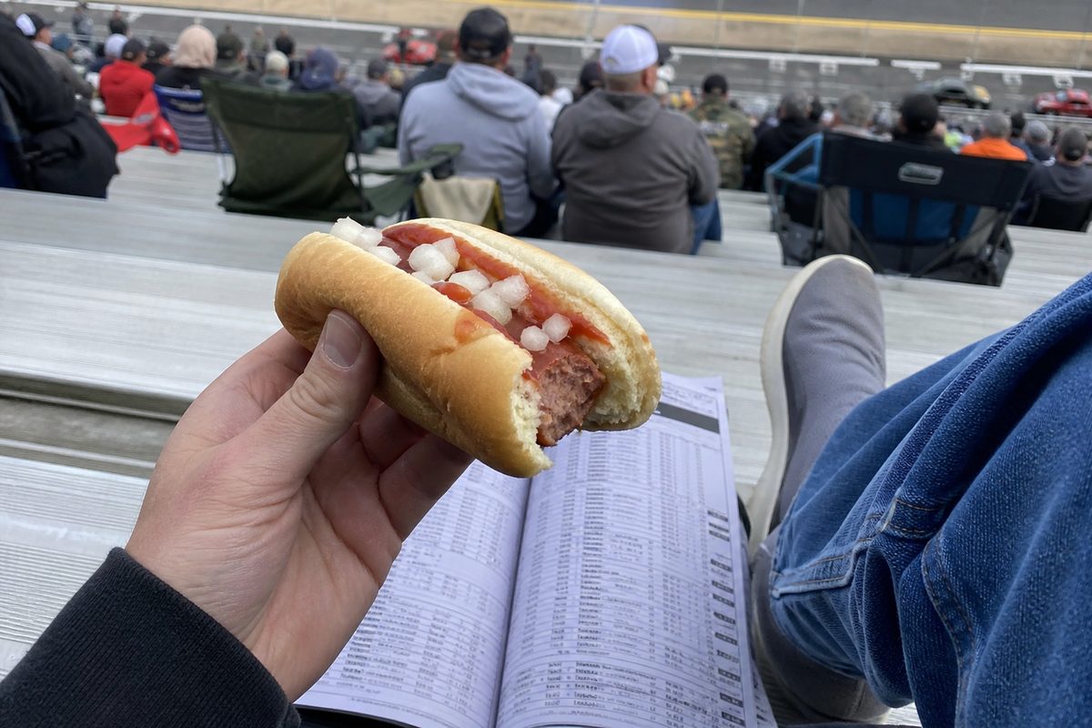 POV of a hot dog over aluminum bleachers