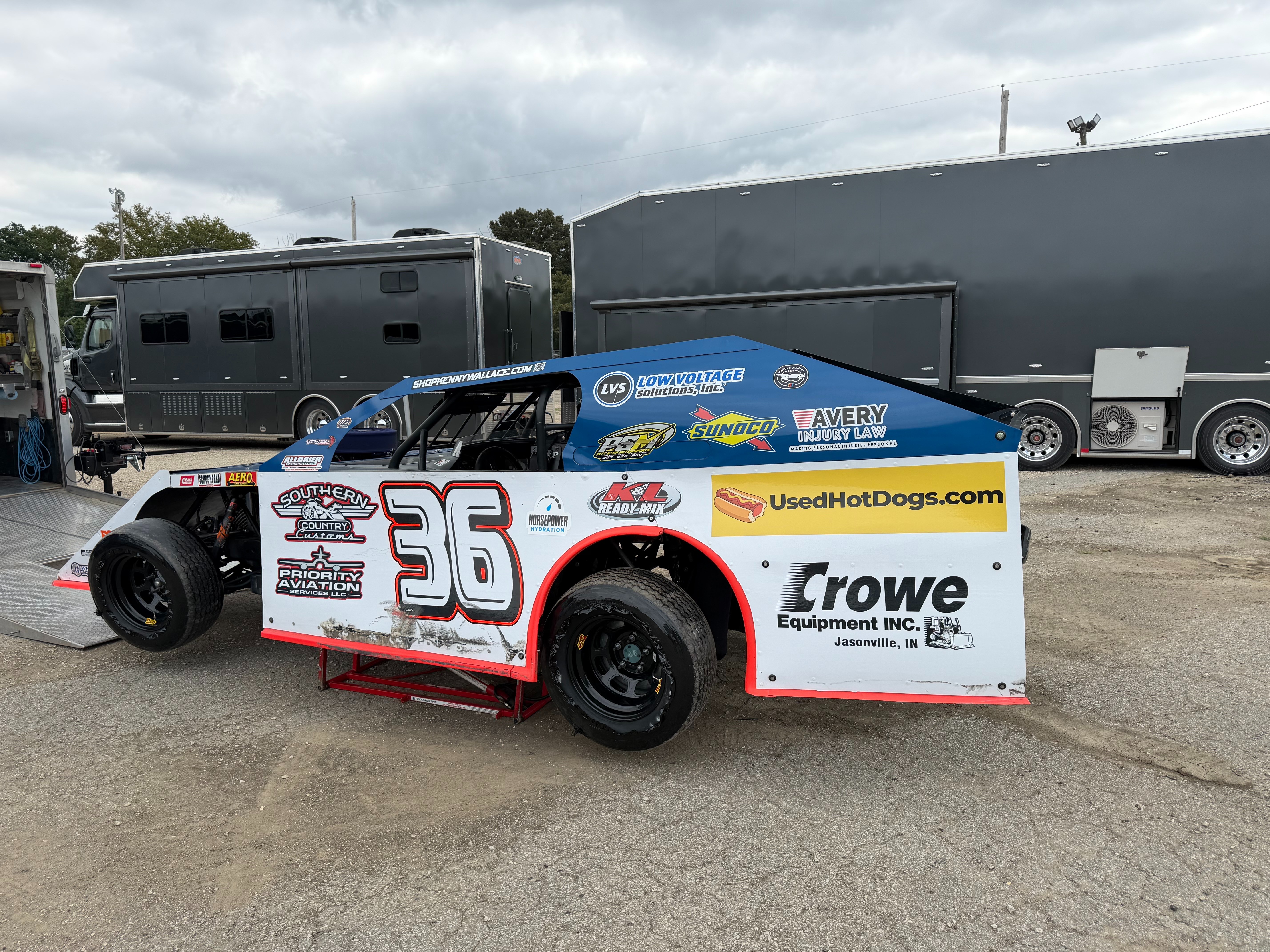 NASCAR legend Kenny Wallace’s number 36 race car with a yellow UsedHotDogs.com panel